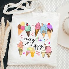 Show off your delicious style with this "Ice Cream Every Flavor of Happy 🍦🌈" tote bag! Featuring a colorful and playful design, this white tote will be your go-to for all of your activities - picnics, festivals, game day, school stuff and Holiday travels! You'll be feeling 'scoops' of happiness" everywhere you go! 🍨 This bag is a perfect way to showcase a bit of your personality! It is practical, stylish and environmentally friendly reusable. We hand press each item with love and care. 💙▸ Di White Canvas Bag For School Summer, Trendy White Bags For End Of School Year, White Letter Print Bag For Back To School, Playful White School Bag, White Playful School Bags, Fun White Canvas Bag For Everyday Use, White Playful School Bag, Playful White Canvas Bag For Everyday Use, Playful White Bags For Everyday