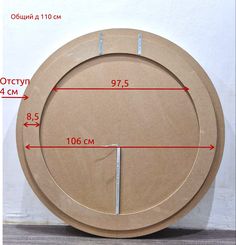 a wooden clock with measurements on it