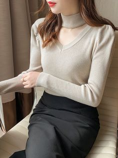 Features: This Hollow Out Halter Turtleneck sweater is the perfect addition to your winter wardrobe. Made with soft, warm fabric, it will keep you cozy on chilly days. The slim fit and solid color make it versatile for any occasion. Stay stylish and comfortable with this must-have knitwear piece.