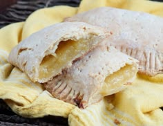 two pastries sitting on top of a yellow towel