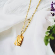 This beautiful Dainty Tag Floral Pendant Necklace adds a sweet and subtle touch of femininity to any look! Perfect for everyday wear or special occasions; style it alone or layer with a choker necklace for a boho-chic look. Made of gold filled and gold plated materials. Made in the USA! Chic Necklace With Rectangular Pendant For Gift, Chic Rectangle Pendant Necklace For Gift, Chic Rectangular Pendant Necklaces For Gifts, Delicate Adjustable Necklace With Flower Pendant, Adjustable Delicate Chain Necklace With Flower Pendant, Adjustable Flower Pendant Necklace With Delicate Chain, Delicate Flower Pendant Necklace Adjustable, Feminine Necklace With Flower Pendant For Her, Feminine Necklace With Flower Pendant As Gift For Her