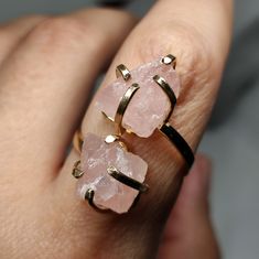 Elevate your style and gift love with our Raw Rose Quartz Ring. This exquisite piece showcases the gentle beauty of rose quartz, known for its soft pink hues and heartwarming energy. It's not just a statement piece; it's a heartfelt gift that captures the essence of affection and elegance. 🔸Adjustable band ring 🔸10 mm each stone size 🔸Color may vary according to lighting 🔸Gold filled We offer  🔸Fast shipping ( under normal conditions) 🔸Free shipping  🔸Polishing cloth ( to keep your piece shiny) 🔸Jewelry case on orders of 100€ 🔸Gift box 🎁 🔸Great customer service                                  Rose quartz is cherished for its association with love and positivity. It's believed to enhance emotional well-being and open the heart. Its gentle pink tones make it a timeless choice for Adjustable Unique Rose Quartz Jewelry, Unique Crystal Ring As A Gift, Pink Crystal Ring Gift, Round Quartz Jewelry Gift, Quartz Jewelry As A Gift, Quartz Jewelry Gift, Handmade Adjustable Rose Quartz Rings, Unique Rose Quartz Jewelry Gift, Pink Quartz Jewelry As A Gift