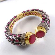 This Listing is for 1 Piece Beautiful Red Aventurine & CZ Hydro Gemstone Gold Plated Cuff Bangle Bracelet Jewelry Gemstone: Red Aventurine & CZ Metal : Brass  Style : Cuff Bracelet  Size : Cuff Adjustable Size Plating : Gold Plated & Black Oxidize  Color : Yellow,White, Black  Note : We Ship Parcel Via India Post Economy Shipping It's Take 20 To 25 Days To Arrive. Check my other items frequently. I will be adding to the inventory regularly. Be sure to visit my shop to check for any coupon codes Stone Bangle Cuff Bracelet For Gift, Stone Cuff Bracelet Bangle As A Gift, Stone-embellished Bangle Cuff Bracelet For Gift, Stone-embedded Bangle Cuff Bracelet For Gift, Traditional Gemstone Cuff Bracelet, Jeweled Ruby Round Bracelets, Red Bangle Jewelry With Jewels, Handmade Ruby Bangle Bracelet, Unique Red Gemstone Bracelet