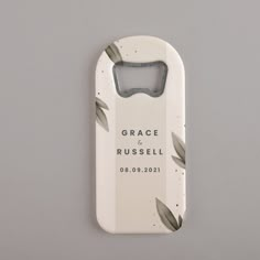 a bottle opener with the words grace russell printed on it