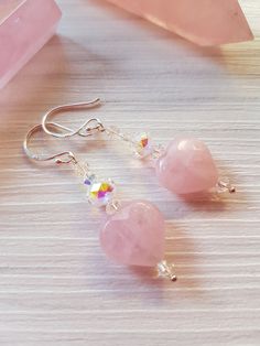 Elegant faceted pretty pink Rose Quartz gemstone heart earrings, dangle drop style featuring beautiful sparkling Swarovski Crystal beads in Clear AB. I have lovingly made these pretty earrings and have used 925 Sterling silver ear wires and sterling silver wire posts, the drop is approximately 4cm, these are pretty eye catching earrings, which you I know you will love  I recently had the honor to made five sets of these beautiful earrings for the lovely bridesmaids at a wedding and they looked a Pink Heart Crystal Earrings For Valentine's Day, Pink Crystal Earrings For Valentine's Day, Pink Heart-shaped Crystal Earrings For Valentine's Day, Pink Heart Beads Sterling Silver Earrings, Pink Sterling Silver Heart Bead Earrings, Pink Sterling Silver Heart Beaded Earrings, Pink Sterling Silver Heart Dangle Earrings, Quartz Gemstones, Pink Rose Quartz