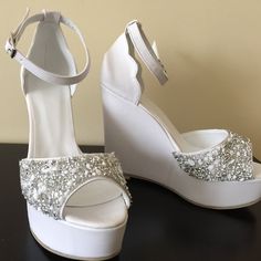 6 cm , 8 cm , 10 cm , 11 cm 12 cm , 13 cm and 14cm heel length options White and ivory color options Silver Platform Heels For Wedding, Wedding Closed Toe Synthetic Wedge Sandals, White Sandals With Deep Heel Cup And Round Toe, Wedding Rhinestone Wedge Sandals Open Toe, Rhinestone Embellished Round Toe Wedge Sandals For Wedding, Rhinestone Wedge Sandals With Round Toe For Wedding, Round Toe Wedge Sandals With Rhinestones For Weddings, Glamorous White Wedding Shoes With 4-inch Heel, White High Heel Wedge Sandals For Party