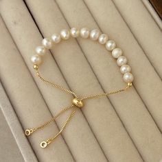 This bracelet is a must-have for your bracelet stack, it is simple for daily wear also would be great for matching your pretty dresses! Great for all occasions. This style is also a great gift for a friend or loved one. 🤍Material🤍 5-6 mm Freshwater Pearls 18K Gold Filled Adjustable bracelet 💛Great For All Occasions  💛Freshwater Pearls 💛18K Gold Filled 💛Hypoallergenic  💛Tarnish Free 💛Gift For Her 💛Birthday Gift 💛Christmas Gift 💛Free Domestic Shipping  🤍 Freshwater Pearl 🤍  The unique features of freshwater pearls, from their origin in freshwater sources to the variety of colors and affordability, make them a standout and accessible choice for stylish and creative jewelry designs🌟 🤍 Packaging 🤍 If you purchase for your loved ones, and wanted to make it look like a nice gift, Minimalist Pearl Bangle Bracelet Gift, Minimalist Adjustable Bracelet As Gift For Her, Elegant White Jewelry With Sliding Knot, Elegant Bracelets With Adjustable Length And Round Beads, Elegant Beaded Bracelets With Sliding Knot, Delicate Adjustable Bracelets For Gifts, Elegant Beaded Bracelets With Sliding Knot For Gifts, Delicate Adjustable Bracelets As Gift, Dainty Adjustable Pearl Bracelet Gift