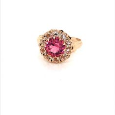 Vintage 1940's 10k yellow gold pink stone ring. The center stone is the color of a gorgeous pink sapphire. The size of the ring is a 5.75, and has the ability to be resized. Classic Pink Cluster Ring For Formal Occasions, Classic Pink Ruby Ring With Halo Setting, Formal Pink Ruby Ring With Accent Stones, Pink Ruby Ring With Accent Stones For Formal Occasions, Classic Pink Cluster Ring With Prong Setting, Classic Pink Cluster Ring With Center Stone, Pink Formal Cluster Ring With Prong Setting, Pink Round Cluster Ring With Halo Setting, Pink Round Cluster Ring With Prong Setting