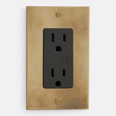 an electrical outlet with two black outlets