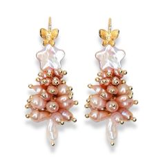 These elegant Christmas tree earrings are handcrafted from dozens of carefully selected freshwater pearls, creating a refined holiday charm. Topped with a natural star-shaped pearl, they add a unique and luxurious touch to the festive design. Pair them with our matching necklace for a complete, sophisticated holiday look that’s perfect for both daily wear and special occasions. These earrings aren’t just accessories—they’re timeless pieces that bring elegance and warmth to the season. Composition：Gold-filled/Freshwater Pearls Handle Gently: Avoid contact with perfumes, cosmetics, and harsh chemicals. Show Love: Clean with a soft cloth and avoid scratching by keeping them separate from other jewelry. Store Safely: When not in use, keep in a jewelry box to maintain their shine. Treat your pe Pearl Christmas Tree, Pearl Christmas, Alphabet Jewelry, Elegant Christmas Trees, Tree Earrings, Christmas Tree Earrings, Stocking Fillers For Her, Forever Jewelry, Earring Tree