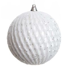 a white ball ornament hanging from a string with silver dots on the top