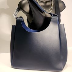 (Nwot)...Simple Yet Classic Neiman Marcos Tote, Can Be Used As A Purse Or Extra Tote Needed For Work Items! Durable Synthetic Material On Exterior Is Resistant To Stains. Strap Is 13.5" Non-Smoking Home Synthetic Materials, Navy Blue Color, Neiman Marcus, Size 16, Bag Lady, Navy Blue, Purse, Tote Bag, Exterior