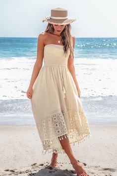 Get beach-ready with the Sand Smocked Tassel Tie Tube Dress! Featuring a comfy smocked top and playful tassel ties, this dress is perfect for sunny days and seaside adventures. Product code: CAA05A4G016GG Features:  Woven Straight neckline Smocked bodice Sleeveless Tassel waist Lace trim Midi Material: 70%NYLON,30%COTTON. Summer Sleeveless Smocked Beach Dress, Summer Beach Maxi Dress With Drawstring, Sundress With Drawstring For Beach Season, Sleeveless Summer Smocked Dress For The Beach, Sleeveless Smocked Dress For Beach, Sleeveless Smocked Dress For Beach In Summer, Sleeveless Smocked Beach Dress For Summer, Spring Beachwear Maxi Dress With Tassels, Sleeveless Smocked Dress For Beach Season