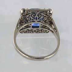 For Sale on 1stDibs - 18K white gold ring, eagle's head hallmark. This splendid rectangular shaped sapphire and white gold ring boasts a cushion cut Ceylan Blue sapphire held Formal Square Cut Sapphire Ring, Rectangular White Gold Sapphire Jewelry, Rectangular Sapphire Anniversary Ring, Sapphire Rectangular Promise Ring, Formal Sapphire Square Cut Rings, Rectangular Sapphire Ring With Prong Setting, Classic Square Cut Sapphire Ring, Fine Jewelry Sapphire Rectangular Ring, Silver Rectangular Sapphire Ring