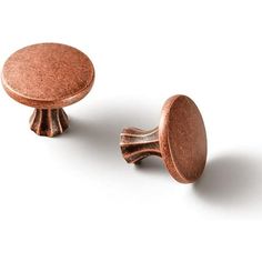 two small knobs on top of each other in different shapes and sizes, one with a