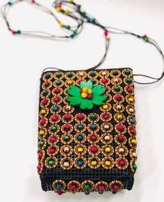 "Instant ethnic flare! Beautiful crossbow bag. 9\" X 7\". Strap is 20\" long. Made in Sierra Leone." Beaded Multicolor Shoulder Bag For Festivals, Beaded Shoulder Bag For Festivals Gift, Multicolor Beaded Shoulder Bag For Festivals, Handmade Shoulder Bag For Festival Gift, Festival Gift Handmade Shoulder Bag, Festival Handmade Rectangular Shoulder Bag, Traditional Rectangular Crochet Bag For Festivals, Handmade Multicolor Festival Bags, Handmade Multicolor Bags For Festivals