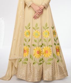 COLOR : Dull Yellow Cream FABRIC : Gown & Dupatta - Premium Silk WORK : Resham Embroidery, Hand Work, Sequins, Floral Motifs, Lace Border OCCASION : Wedding, Reception, Mehendi, Party Wear, Festival READY-TO-WEAR : No STITCHING : Available as semi-stitched fabric, can be stitched using standard size option (+$30). Note: There might be a slight color variation due to lighting and flash used during photoshoot. The bright shade seen is the best closer view of fabric's color. Silk Anarkali Gown, Mehendi Party, Cream Gown, Embroidery Hand Work, Resham Embroidery, Silk Anarkali, Gown Party Wear, Party Wear Gown, Embroidery Hand