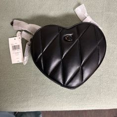 Nwt Coach Heart Bag In Black Quilted Napa Leather. Perfect Condition! Some Smudges Noted On The Leather. Gunmetal Hardware, Double Zip Closure, Crossbody Adjustable Leather Strap, Hangtag And Dust Bag Included. Heart-shaped Leather Shoulder Bag, Leather Heart-shaped Bag With Detachable Strap, Elegant Heart-shaped Shoulder Bag For Shopping, Leather Bags With Adjustable Strap For Valentine's Day, Everyday Use Heart-shaped Leather Shoulder Bag, Leather Shoulder Bag For Valentine's Day Evening, Luxury Leather Heart-shaped Bag, Leather Shoulder Bag For Evening And Valentine's Day, Valentine's Day Leather Shoulder Bag For Evening