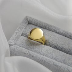 Circle Signet Rings14k Gold Plated Stainless SteelOur Signet Rings are the perfect marriage of elegance and charm. They make the perfect addition to any jewelry collection. These fashionable accessories are minimalist in make, yet timeless in style. The base of each Signet Ring is made with 14k Gold Plated Stainless Steel, allowing them to keep their color over time. All of our pieces are made with lightweight and hypoallergenic materials, allowing for easy, comfortable, all day wear.If you love Elegant Rings Gift, Modern 14k Gold Engraved Ring For Wedding, Timeless Gold Rings With Classic Design, Classic Formal Couple Rings Stamped 14k, Gold Heirloom Ring With Classic Design, Heirloom Style Gold Ring With Classic Design, Heirloom Gold Ring With Classic Design, Timeless Polished Finish Couple Rings, Gold Engraved Ring With Classic Design