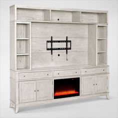 a white entertainment center with a fire place