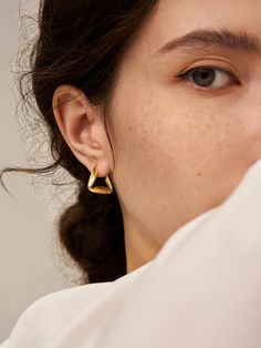 The defining feature of Triangle Hoop Earrings is the shape of the hoops. Instead of the classic circular shape, these earrings showcase triangular hoops that create a bold and eye-catching look. The triangular shape adds a geometric and angular element, offering a fresh and dynamic aesthetic. Details Recycled Silver: 18ct gold vermeil Height: 18cm Width: 20cm Earrings are sold in pairs See how influencers elevate their style with timeless gold vermeil pieces. @gemmaamclean Modern Triangle Gold Hoop Earrings, Modern Triangle Metal Earrings, Modern Geometric Single Hoop Earring, Elegant Everyday Triangle Earrings, Modern Single Triangle Earring, Bold Earrings, Ear Cuff Earings, 30 Gifts, Recycled Silver