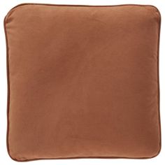 a brown pillow on a white background