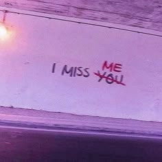 graffiti written on the side of a wall that says i miss you with red spray paint