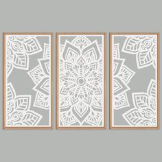 three white wall art pieces with intricate designs