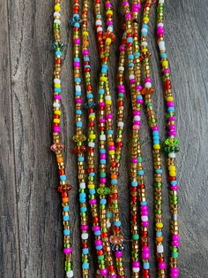 These beads come in TIE ON only, they are 45"- 55" long and self adjustable based on your waist size. ★ Please note, the Bead option you pick is exactly what you'll receive. ★ The listed prices are for one strand each. For multiple strands you'll have to indicate from the quantity section in your cart. ﻿★★★★ ALL SALES ARE FINAL. THERE ARE NO EXCHANGES OR RETURNS★★★★ Uses of Waist beads ★ Cultural and Spiritual Reasons ★Waist beads as ornaments as well as for symbolic adornment, ★ which serves as Multi-strand Beaded Waist Beads For Festival, Adjustable White Waist Beads For Festival, Adjustable White Bohemian Waist Beads, Bohemian Waist Beads For Summer Beach, Bohemian Waist Beads For Beach In Summer, Bohemian White Waist Beads For Festivals, Multicolor Beaded Chain Waist Beads For Festivals, Colorful Waist Beads For Summer Beach, Bohemian Summer Festival Waist Beads