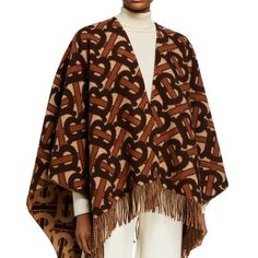 *New With Tags. Msrp Is $1,250.00 + Taxes. See Neiman's Order Slip Photo Above. Burberry 'Charlotte' Tb Poncho Cape, "Dark Mocha" (Dark Brown/Medium Brown/Cream Accents) - One Size 'Tb' Iconic Monogram Print Adorns. ~Approx. 55" Square (137cm X 140cm). Material: 90% Merino Wool, 10% Cashmere. Made In Scotland. Dry Clean Only. Open Front. Knit Style. Fringe Trim Detail At End. Fringe Cape, Burberry Monogram, Burberry Logo, Cashmere Cape, Cashmere Poncho, Burberry Jacket, Poncho Cape, Jacquard Weave, Signature Logo