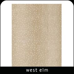 the west elm rug is shown in beige with white dots on it's surface