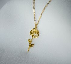 This beautiful gold or silver June Rose birth flower necklace would be a perfect gift for a Mom, Grandma, Aunt, bridesmaid, friend, or any loved one. It's a perfect way to celebrate a family. The back of the pendant has the month and flower type engraved. You can add up to 4 birth flower pendants and birthstones. These are also available without a birthstone. It can be made with a gold or silver plated chain or a sterling silver, or 18k gold-filled chain and is available in 16, 18 or 20 inches ( Dainty Rose Charm Necklace For Gift, Elegant Rose Design Charm Necklace For Gift, Elegant Rose Design Charm Necklace Gift, Dainty Rose Gold Flower Necklace As Gift For Her, Gold Sterling Silver Flower Necklace As Gift For Her, Rose Gold Flower Necklace As A Gift, Rose Gold Flower Necklace As Gift, Rose Gold Flower Necklace With Rose Design, Gold Flower Pendant Jewelry With Roses