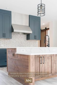 a kitchen with blue cabinets and white counter tops