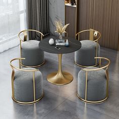 a table with four chairs around it and a vase on the table next to it