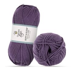 a ball of purple yarn next to it