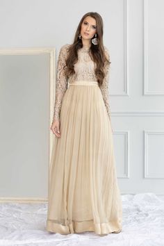 Model: 5'8 - 176 cm and 117 lbs - 53 kg size S Mars -a grandeur in ivory beige is a formal must-have. This stunning long maxi dress features the skill of sequins and zari artisan in a classic light gold jacket that sparks the elegance. The chiffon hemline flaunts with shamus silk border and belt details make the dress an epitome of regality. Mars is your pick to enchant your magic and be effortlessly stylish. Dress: Color: Beige   Fabric: Net and chiffon  Long maxi with embroidered bodice  Cut-dana embroidery  Cotton silk lining inside     Full semi-sheer sleeves  Shamooz silk belt and border Gold Jacket, Embroidered Bodice, Long Maxi, Sheer Sleeves, Cotton Silk, Long Maxi Dress, Dress Clothes For Women, Bodice, Models