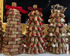 three wine cork christmas trees made to look like they are stacked on top of each other