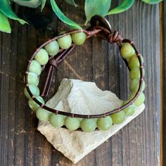 This green Jade bracelet would make the perfect gift for someone special to you or yourself. Green Jade is said to bless whatever it touches. It is also known as the crystal of love. It is said to be supportive of new love, and has been said to increase trustworthiness and fidelity. This bracelet would make the perfect couples gift. The bracelets can be made in a variety of lengths to fit men and women. Faceted Beads Bracelets As May Birthstone Gift, May Birthstone Bracelets With Faceted Beads As Gift, Adjustable Spiritual Wrap Bracelet With Faceted Beads, Adjustable Aventurine Beaded Bracelets For Spiritual Use, Hand Wrapped Rosary Bracelet With Round Beads For Healing, Gemstone Beads Wrap Bracelet As Gift, Adjustable Jade Beaded Bracelet For Healing, Hand Wrapped Crystal Bracelet With Round Beads For Friendship, Hand Wrapped Rosary Bracelet For Healing