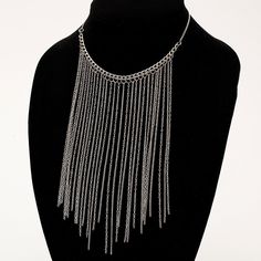 Long flowing silver chain fringe necklace with varying length dangling chain. The necklace is designed at 19 inches in length and is self adjustable to shorter sizes. It hangs about 16 inches in the front. It is light weight, comfortable and very modern. The design is made with two different types of link chain to add an extra layer of interest. The metal is nickel free silver coated brass and has a dull toned shine. Perfect with V-Neck shirts and scoop necklines.  I can custom fit the necklace Silver Metal Tassel Necklace For Party, Silver Metal Tassel Necklace With Adjustable Chain, Silver Tassel Necklace With Adjustable Chain, Neckline Necklace Guide, Gem Necklaces, Hair Contouring, Fringe Jewelry, Trendy Chokers, Waterfall Necklace