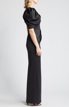 A decadent puffed sleeve is the pièce de résistance on this shoulder-baring gown that's guaranteed to stun. 60" length (size 8) Side-zip closure One-shoulder neckline Single elbow-length sleeve Lined 90% Polyamide, 10% Elastane Dry clean Imported Special Occasion Elegant Black One-shoulder Gown, Black Sleek One-shoulder Formal Dress, Black One-shoulder Dress With Draped Sleeves, Luxury Black One-shoulder Maxi Dress, Luxury Black One-shoulder Top With Asymmetrical Neckline, One Shoulder Gown, Black Halo, Elbow Length Sleeve, Side Zip