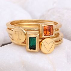 "Know someone with a May birthday ~ this is the perfect gift! Stackable birthstone rings are the IT accessory. Wear by itself or pair with with an initial ring! This listing is for one 24K gold vermeil stackable birthstone ring with a Swarovski crystal (please see color chart for color selection). Round, square, or rectangle stone settings are available. Want more rings or a different month? Build Your Own Gold Stackable Ring listing: https://www.etsy.com/listing/250020772 Also, available in SIL Birthstone Ring Stack, Stackable Gold Rings, Mom Rings, Mothers Ring Stackable, Mothers Rings, Ring For Mom, Initial Rings, Stackable Birthstone Rings, Gold Initial Ring