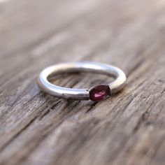 Faceted Garnet Sterling Ring Faceted red oval shaped garnet set in sterling silver ring . stone approx. 30mmx25mm Oval shaped Natural Garnet Size 7 Oval Sterling Silver Ruby Promise Ring, Sterling Silver Oval Cabochon Ruby Ring Gift, Red Oval Stackable Promise Rings, Oval Garnet Rings As Gift, Oval Garnet Ring For Gift, Oval Ruby Gemstone Stackable Rings, Handmade Oval Garnet Rings, Oval Silver Garnet Birthstone Ring, Oval Cabochon Ruby Ring In Silver