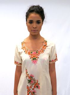 The Ethnic Tunic Dress Traditional Salwar Kameez With Embroidered Neckline, Festive Fitted Kurta With Embroidered Neckline, Fitted V-neck Kurta With Printed Motifs, Fitted Kurta With Embroidered Neckline For Festive Occasions, Fitted Anarkali Kurta With Embroidered Neckline, Fitted Straight Kurta With Embroidered Neckline, Fitted Multicolor V-neck Kurta, Fitted V-neck Kurta For Navratri, Bohemian Kurta With Embroidered Neckline For Navratri