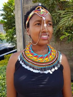 100% handmade using original fine beads. The set is normally worn by the Samburu women tribe during weddings. Perfect for weddings, African themed events, traditional events..the list is endles. In this listing you get; * 4 in 1 necklace set. *1 head piece. *matching earrings. **Buy multiple items and pay shipping for 1 item only.The rest ships free. More neckleces here; https://www.etsy.com/shop/TribalTess?ref=seller-platform-mcnav&section_id=21306083 Back to my shop; https://www.etsy.com/s Women Tribe, Beadwork Necklace, Rope Jewelry, African Necklace, Couple Wedding Rings, Head Jewelry, Beaded Rope, Handmade Bangles, Themed Events