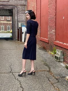 Beautifully detailed 1950s Wiggle Dress in dark Navy with unique satin peplum. In excellent condition. Seems hardly if ever worn. Back metal zip. Measurements Navy Retro Dress For Formal Occasions, Vintage Knee-length Semi-formal Dress, 1950s Style Fitted Tea Length Vintage Dress, Vintage Semi-formal Knee-length Dress, Fitted Dresses In 1950s Style For Formal Occasions, 1950s Style Fitted Formal Dresses, Fitted Vintage Dress For Semi-formal Occasions, Fitted 1950s Style Vintage Dress For Vintage Events, 1950s Style Vintage Dress For Formal Occasions