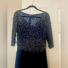 Gorgeous Navy Dress That Can Be Worn At Formal Gatherings Or Weddings. Long With Long Sleeves, Embellished With Sequin On Top. Very Elegant And Feminine. Elegant Embellished Evening Dress For Festive Occasions, Formal Floor-length Embellished Dress, Embellished Gala Evening Dress For Mother Of The Bride, Blue Embellished Evening Dress, Fitted Sequin Evening Dress For Mother Of The Bride, Fitted Embellished Mother Of The Bride Evening Dress, Mother Of The Bride Fitted Sequin Evening Dress, Embellished Fitted Mother Of The Bride Dress, Dressy Embellished Mother Of The Bride Evening Dress