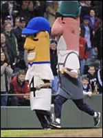 the baseball players are dressed in costumes and walking on the field with people behind them