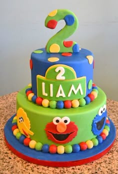 a sesame street birthday cake with the number two on it's top and an elm