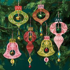 christmas ornaments hanging from a tree on a green background