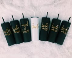 five black and gold bridesmaid tumbles on a white furnishing